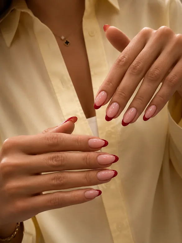 Burgundy French tip almond nails by Batoul Beauty