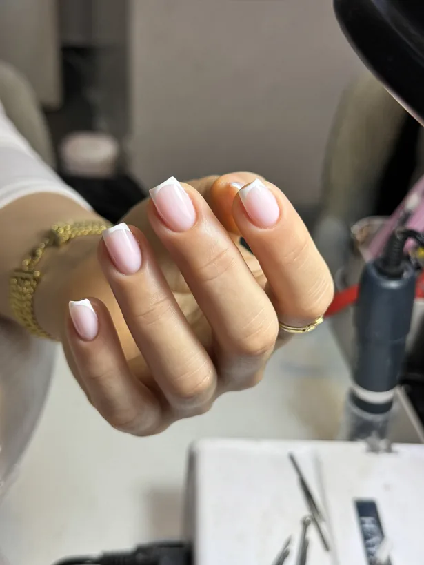 French manicure with glitter accent
