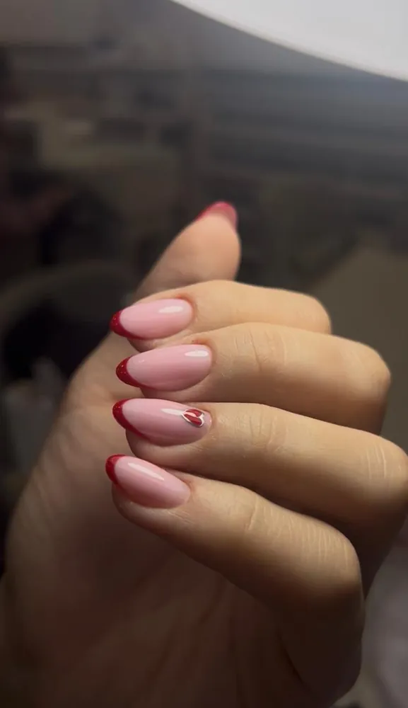Pink nails with red French tips and heart